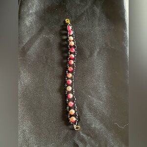 Elegant Beaded Bracelet with Red and Black Accents